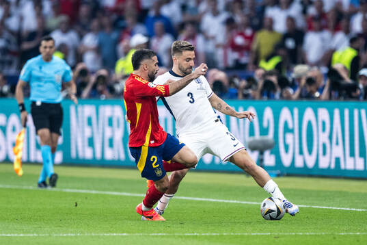 Daniel Carvajal of Spain and Luke Shaw of England