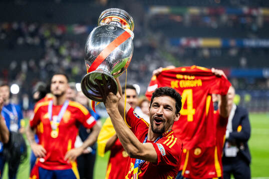 Jesus Navas of Spain celebrates with the trophy