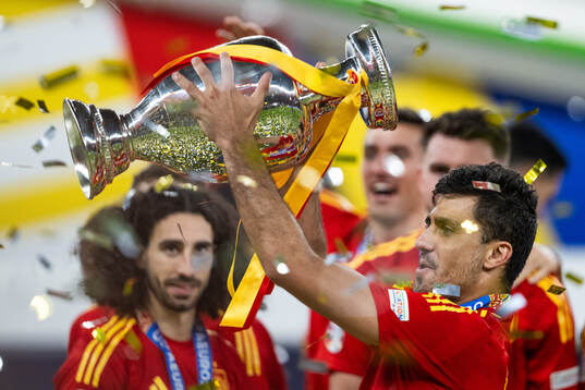 Rodri of Spain celebrates with the trophy