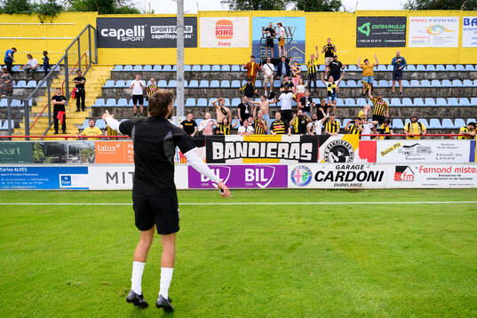 Fans of Häcken celebrate with Simon Sandberg