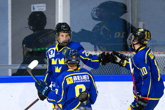 Leo Tjälldén of Sweden celebrates with teammates