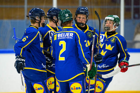 Oscar Holmertz of Sweden celebrates with teammates