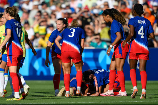 Lindsey Horan of USA in pain in the women’s football final between Brazil and USA
