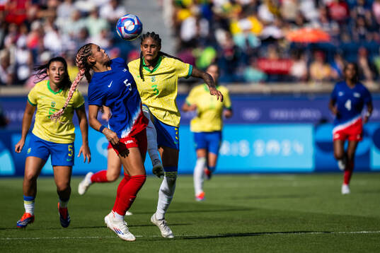 Trinity Rodman of USA and Tarciane of Brazil in the