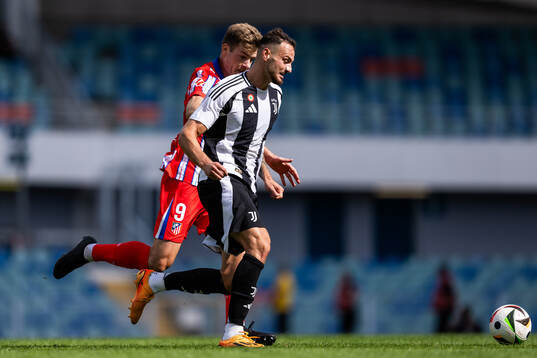 Alexander Sørloth of Atletico Madrid and Federico Gatti of Juventus
