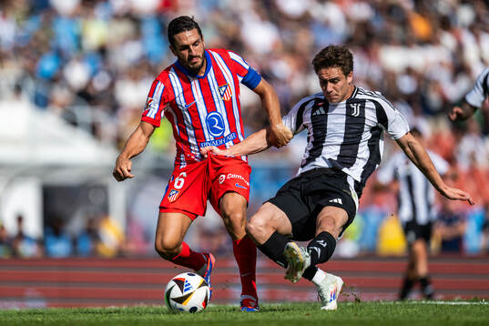 Koke of Atletico Madrid and Kenan Yildiz of Juventus