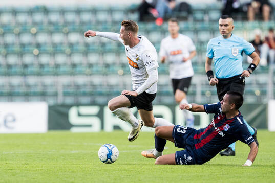 Julius Lindberg of Häcken and Milan Delevic of Paide