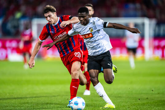 Luca Kerber of Heidenheim and Akoua Romeo Amane of Häcken