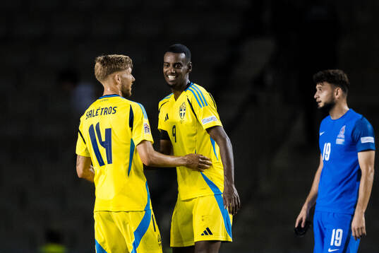Anton Salétros and Alexander Isak of Sweden celebrate