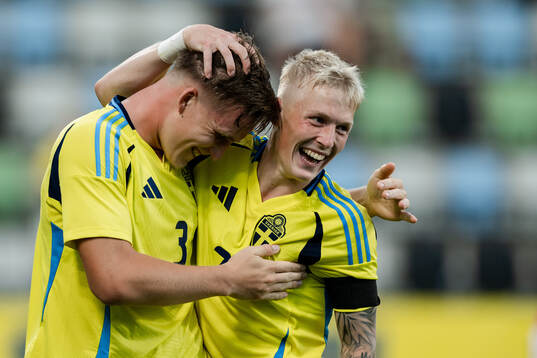 Casper Widell and Melker Widell of Sweden celebrate the 6-0
