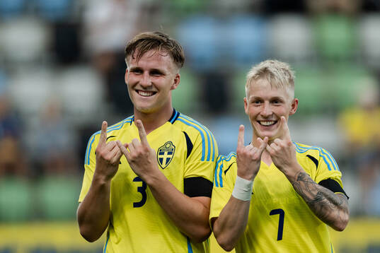 Casper Widell and Melker Widell of Sweden celebrate the 6-0