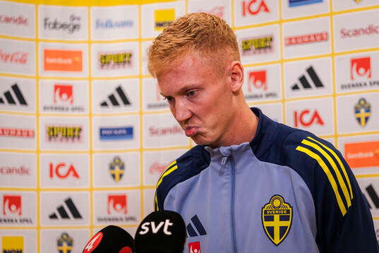 Hugo Larsson of the Swedish men's football national team in the mixed zone