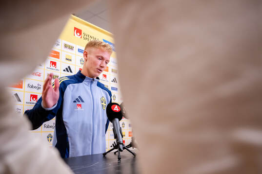 Hugo Larsson of the Swedish men's football national team in the mixed zone