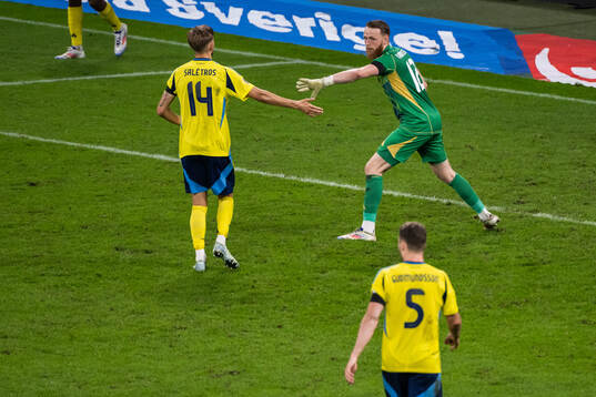 Anton Saletros and goalkeeper Viktor Johansson of Sweden