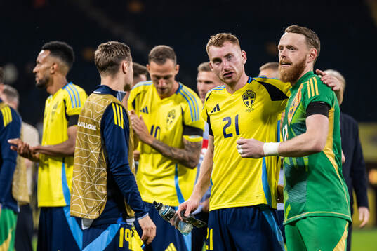 Dejan Kulusevski and goalkeeper Viktor Johansson of Sweden