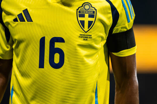 Niclas Eliasson of Sweden with a black armband in honor of