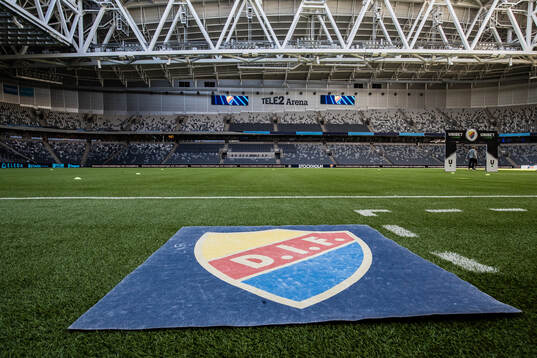 En matta med Djurgården logotyp