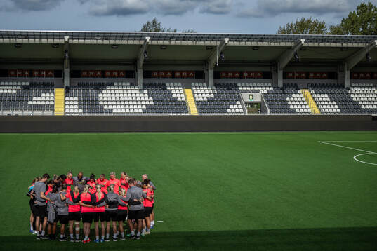 Players and staff gather