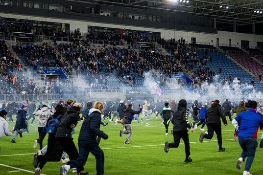 Spectators in the stands celebrates promotion to the Eliteserien