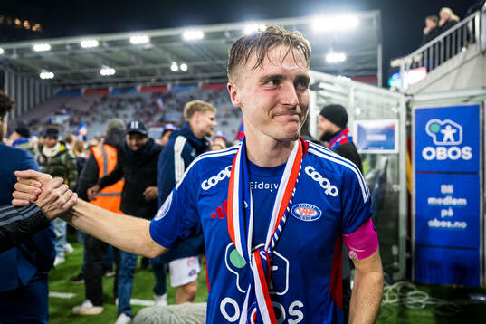 Christian Borchgrevink of Vålerenga celebrates promotion to the Eliteserien