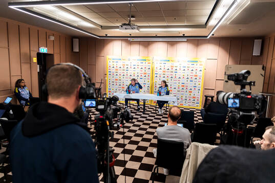 Head coach Jon Dahl Tomasson and media officer Petra