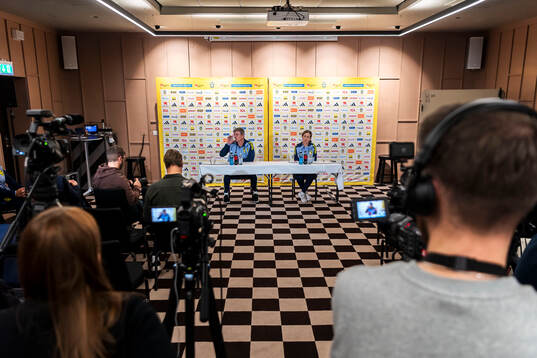 Head coach Jon Dahl Tomasson and media officer Petra