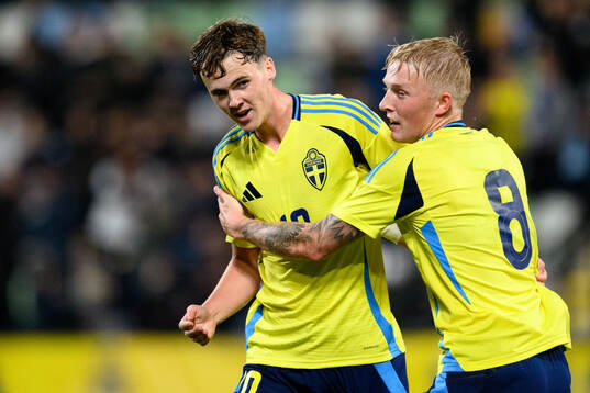 Williot Swedberg of Sweden celebrates with Melker Widell after 2-1