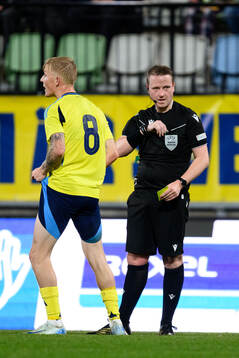 Melker Widell of Sweden reacts against Referee  Iwan Arwel Griffith