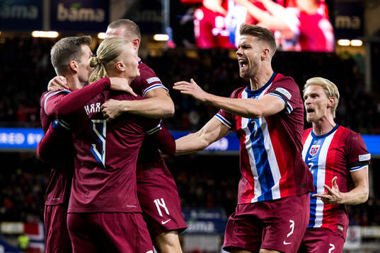Erling Braut Haaland of Norway celebrates with Kristoffer Ajer after 1-0