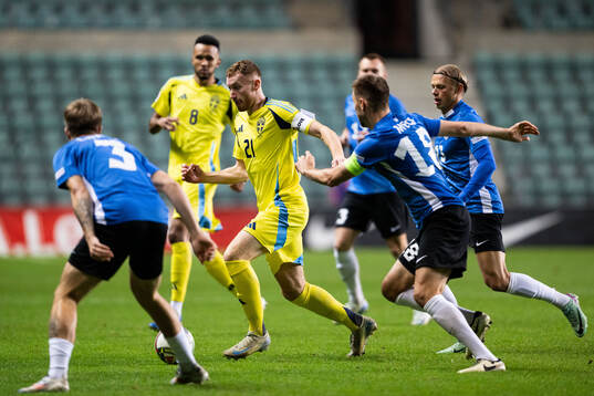 Dejan Kulusevski of Sweden and Karol Mets of Estonia