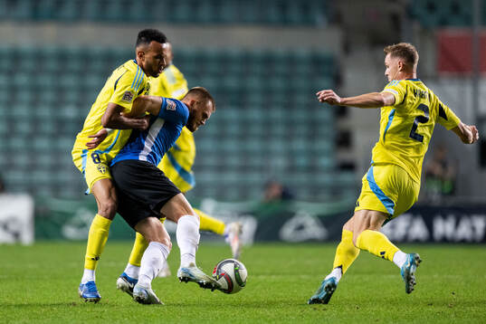 Alex Douglas and Emil Krafth of Sweden against Alex Matthias Tamm of Estonia