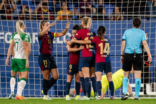 Claudia Pina and Fridolina Rolfö of Barcelona celebrate