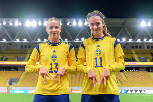 Mollie Josefsson and Thelma Person Welin of Sweden celebrate