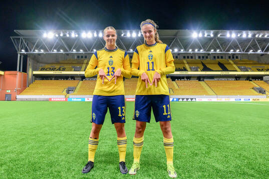 Mollie Josefsson and Thelma Person Welin of Sweden celebrate