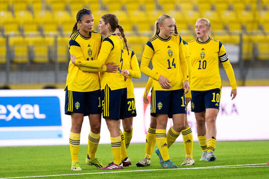 Thelma Person Welin of Sweden celebrate with teammates