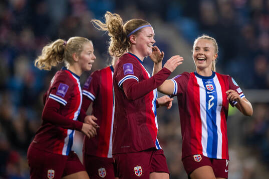 Signe Gaupset of Norway celebrates with teammate Emilie Woldvik after scoring 7-0