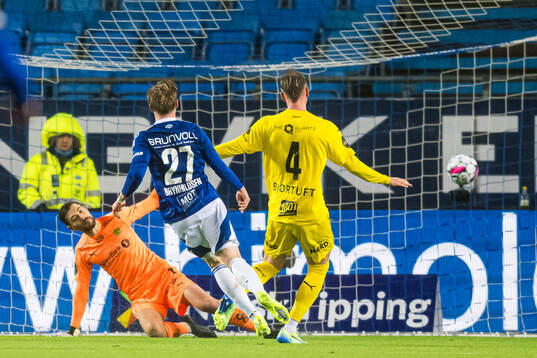 Ola Brynhildsen of Molde scores the 2-0 goal behind Nikita