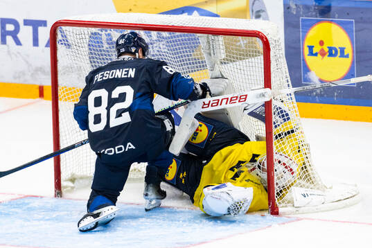 Harri Pesonen of Finland and goalkeeper Jacob Johansson of
