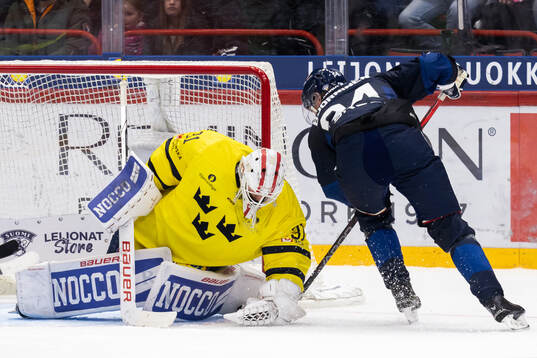 Goalkeeper Jacob Johansson of Sweden and Hannes Björninen
