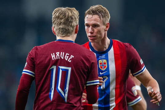 Jens Petter Hauge of Norway celebrates with teammate Torbjørn Lysaker Heggem after scoring 1-4
