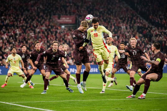 Rasmus Højlund of Denmark and Martin Zubimendi of Spain