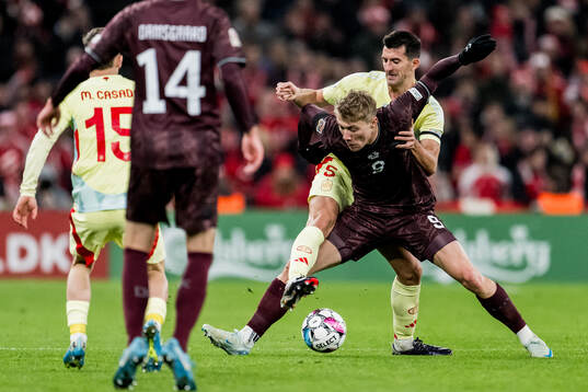 Rasmus Højlund of Denmark and Daniel Vivian of Spain