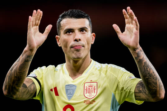 Pedro Porro of Spain celebrates