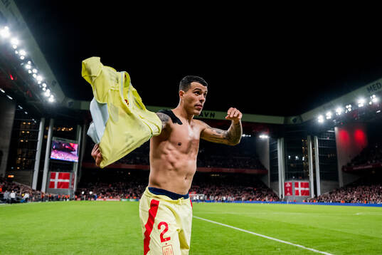 Pedro Porro of Spain celebrates