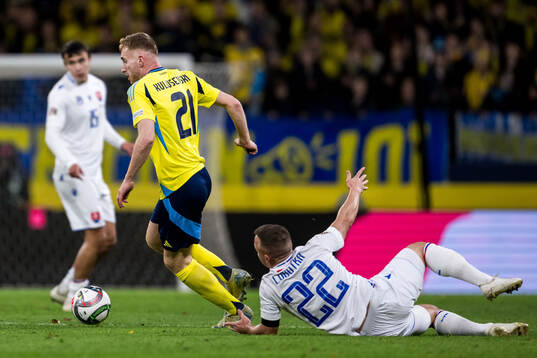 Dejan Kulusevski of Sweden and Stanislav Lobotka of Slovakia