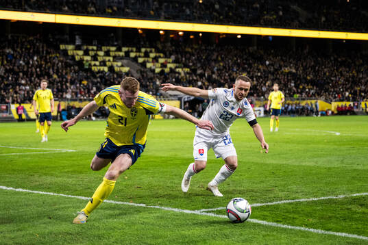 Dejan Kulusevski of Sweden and Stanislav Lobotka of Slovakia