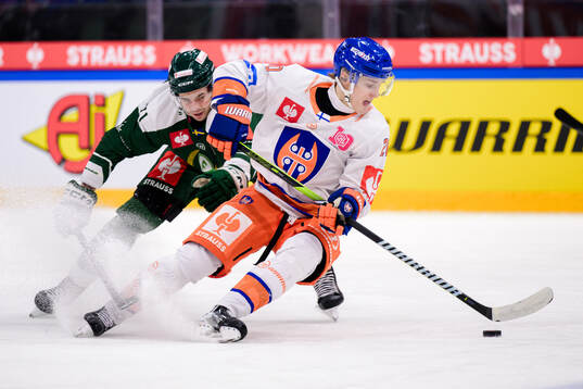 Viktor Lodin of Färjestad  and Oiva Keskinen of Tappara