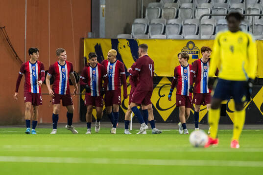 Adrian Kurd Rønning of Norway celebrates after 0-2