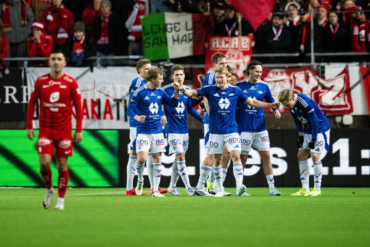 Kristian Eriksen of Molde celebrates with team mates after 2-0