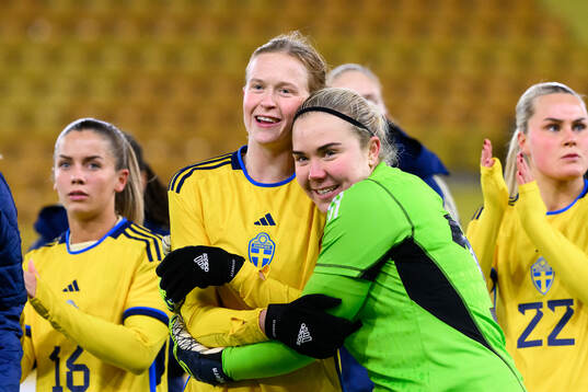 Emma Östlund and goalkeeper Sofia Hjern of Sweden celebrate